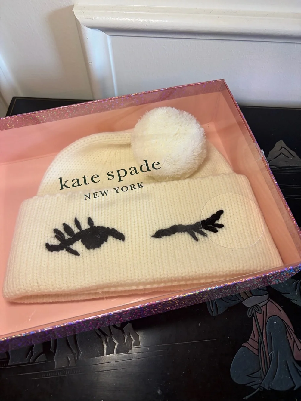 NWOT Kate spade cream knit beanie with pom and eyelash applique